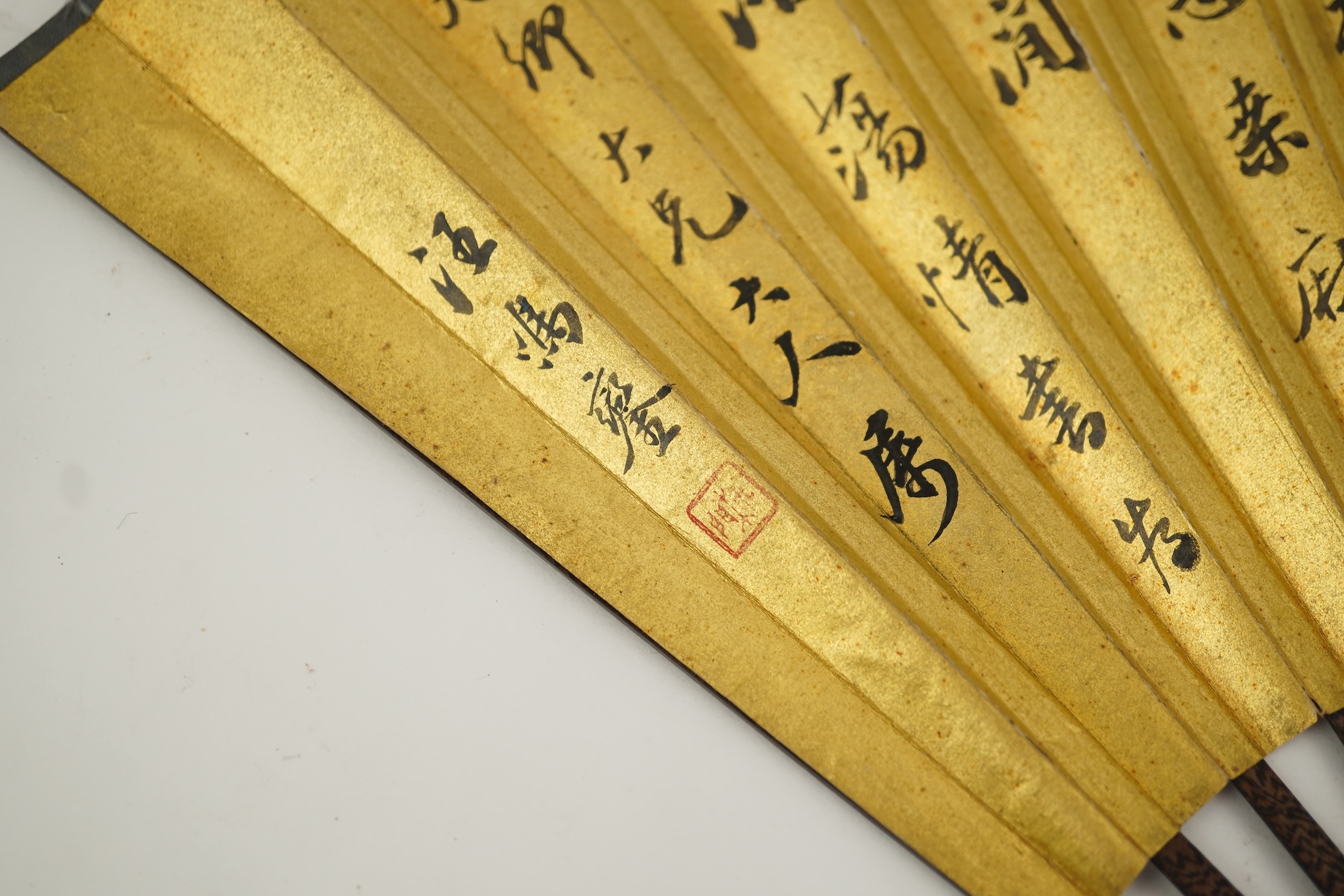 Two Chinese inscribed paper leaf fans, late 19th century